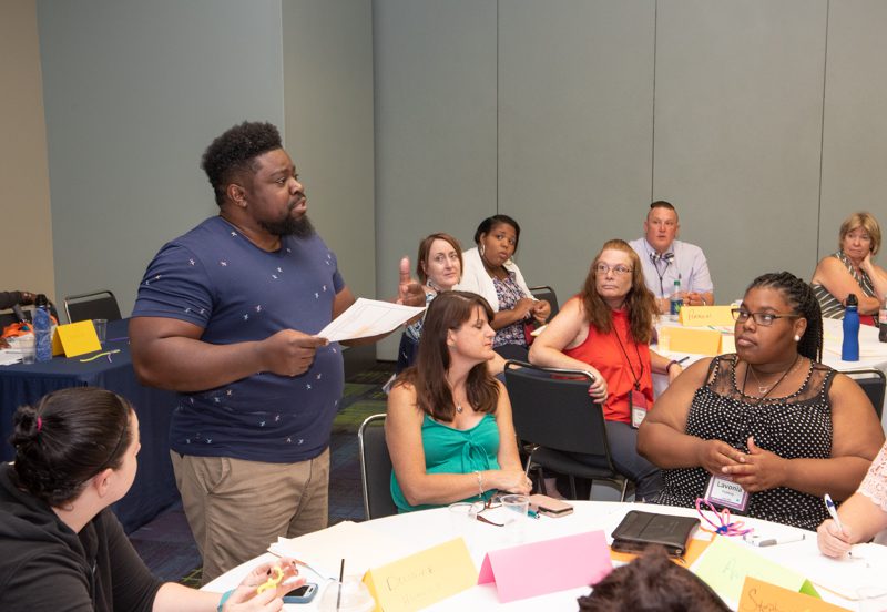 woman instructing at a conference